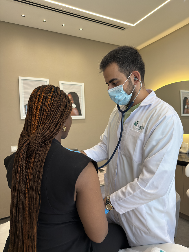 A Cube65 specialist consulting with a patient